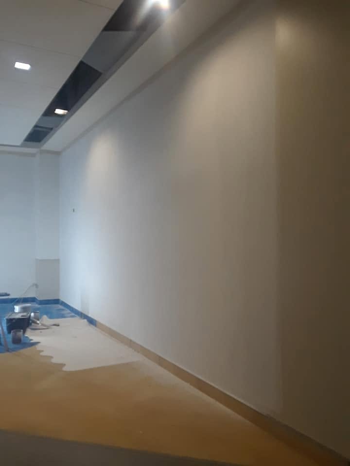 The finished wall: patched, primed, and painted out.