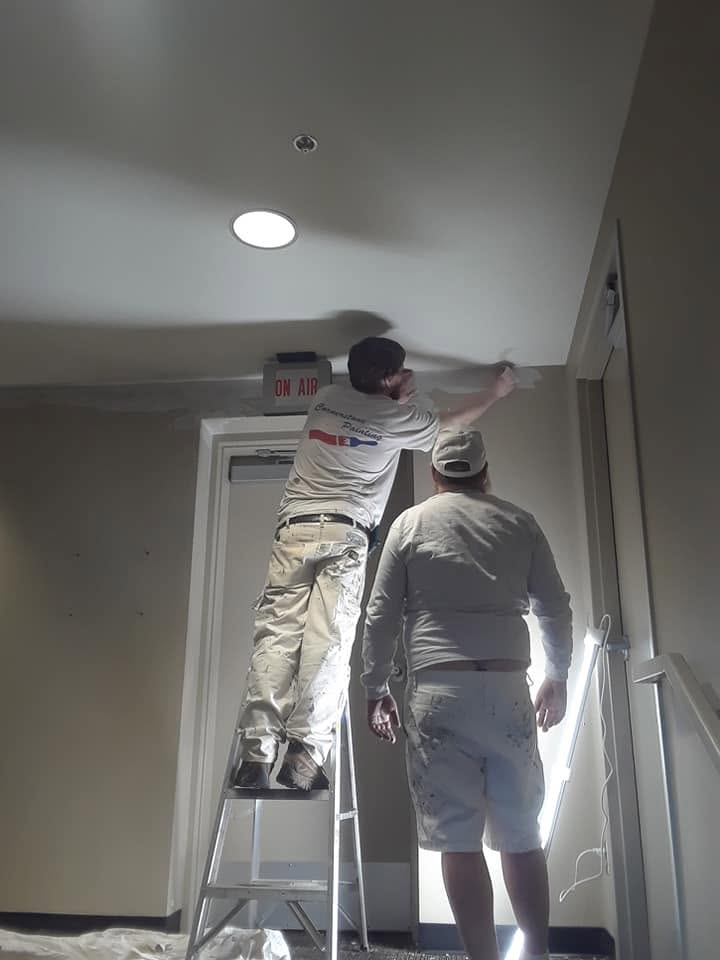 That's the crew, mid-job. Hand work right at the ceiling line.