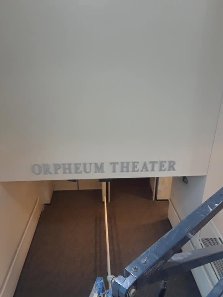 The Orpheum Theater letters over the freshly painted wall.