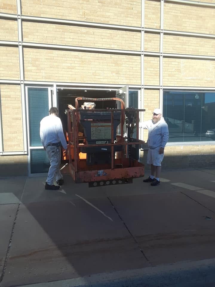 Move-in day at the Orpheum: wheeling the boom lift in through the doors.